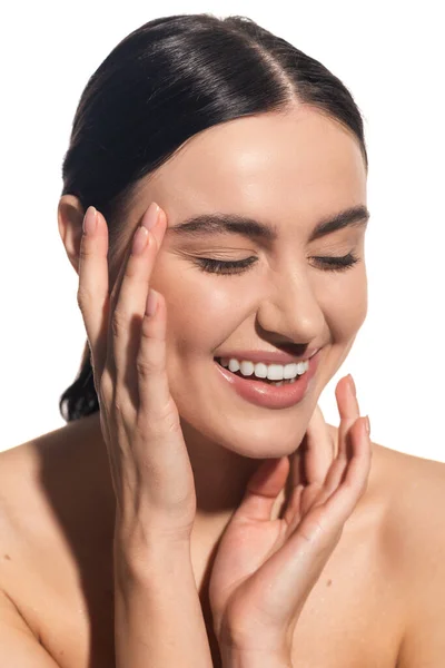 Cheerful young woman with closed eyes and flawless makeup isolated on white — Stock Photo
