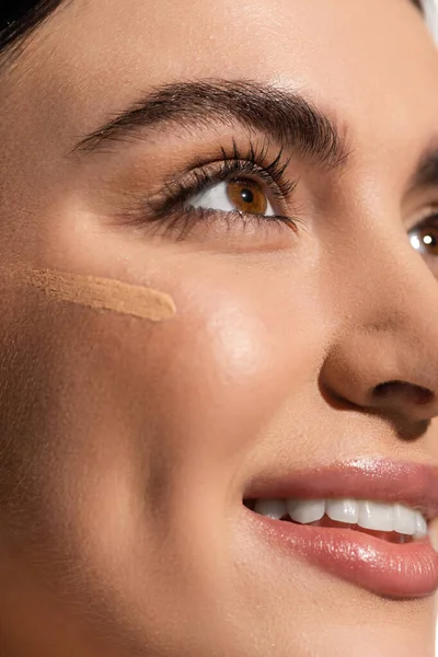 Makeup foundation smudge on face of happy young woman with soft skin — Stock Photo