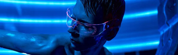 Futuristic science concept, cosmic alien in goggles in neon-lit innovative science center, banner — Stock Photo