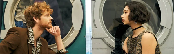 Вид збоку стильної багатоетнічної пари біля пральних машин в громадському пральні, банер — стокове фото