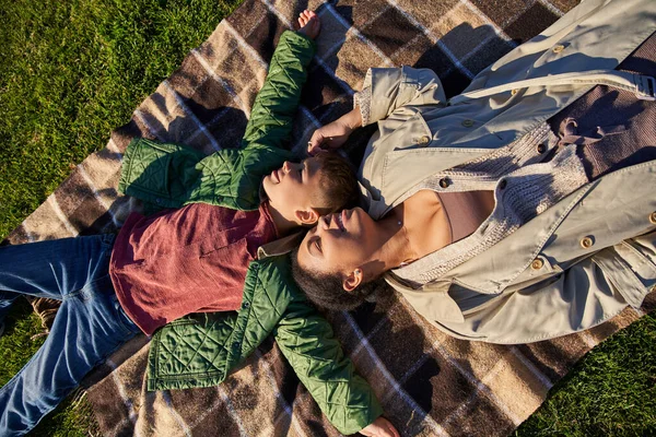 Top view, happiness, joyful memories, african american mother and son lying on blanket, autumn — Stock Photo