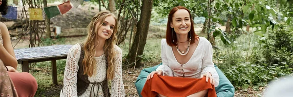 Happy women in boho styled clothes spending time outdoors in retreat center, banner — Stock Photo
