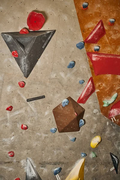 Vertical detailed shot of climbing rock wall with different sized boulders, sport and fitness — Stock Photo