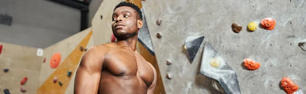 Handsome fit african american man with his shirt off and hands behind his back looking away, banner — Stock Photo