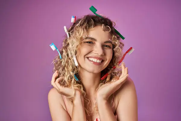 Lovely woman dressed as tooth fairy smiling cheerfully at camera with hands raised to face — Stock Photo