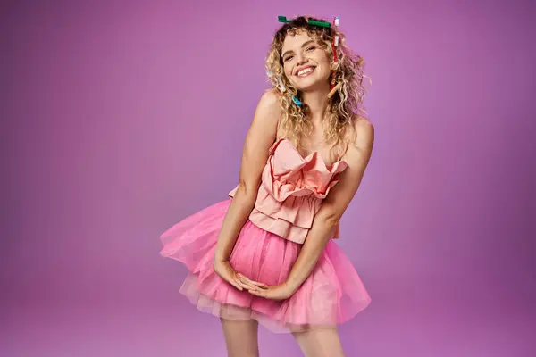 Cheerful woman in tooth fairy outfit smiling cheerfully at camera and posing with lowered hands — Stock Photo