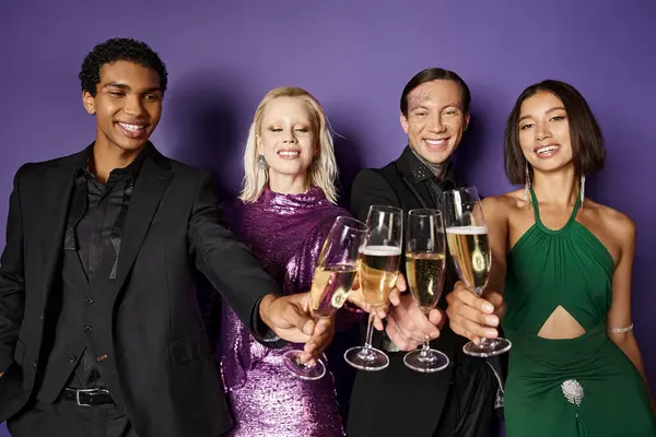 Christmas party, group of cheerful interracial friends in festive attire clinking champagne glasses — Stock Photo
