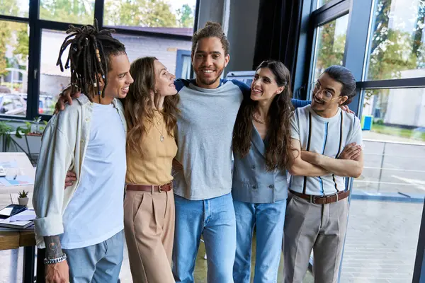 Happy multicultural team looking at african american team lead in coworking office, group portrait — Stock Photo