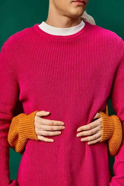 Cropped view of woman hugging boyfriend in pink knitted sweater, hands of loving couple — Stock Photo
