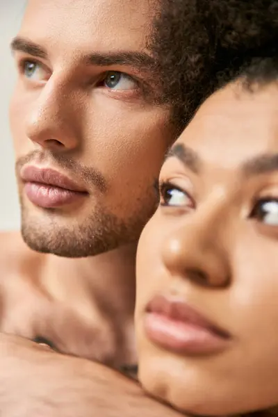 Appealing multicultural boyfriend and girlfriend posing together and hugging lovingly, sexy couple — Stock Photo