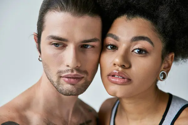 Attractive girlfriend and young boyfriend posing together and looking at camera, sexy couple — Stock Photo