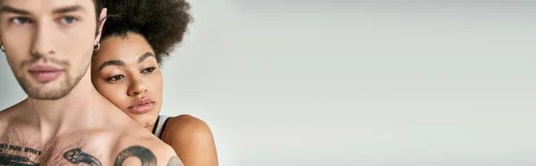 Young african american woman hugging warmly her good looking boyfriend from behind, banner — Stock Photo