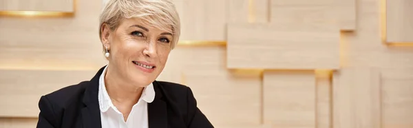 Happy middle aged realtor with short hair working in real estate office, busy working day banner — Stock Photo