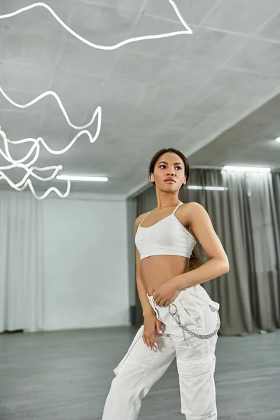 Graceful african american dancer in black crop sweater rehearsing in dance hall, horizontal banner — Stock Photo