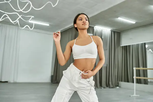 Graceful african american dancer in black crop sweater rehearsing in dance hall, horizontal banner — Stock Photo