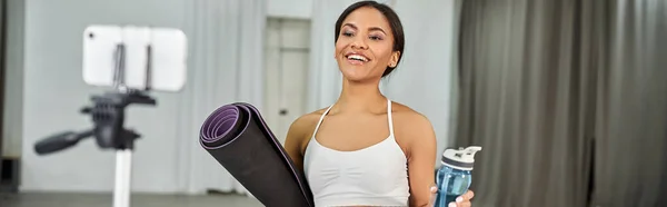 Graceful african american dancer in black crop sweater rehearsing in dance hall, horizontal banner — Stock Photo