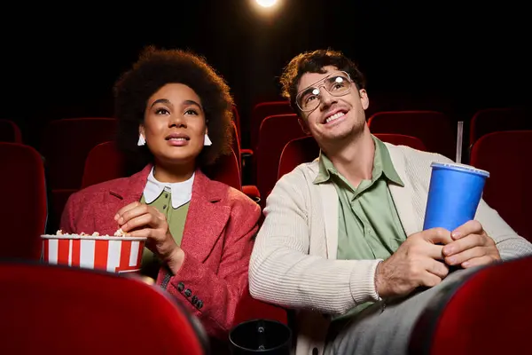 Jolly multicultural couple in retro stylish clothes watching movie together on date, Valentines day — Stock Photo