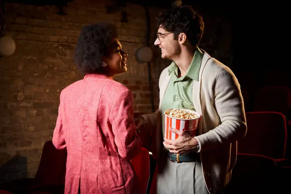 Joyous attractive diverse couple having good time on date and smiling happily at each other — Stock Photo