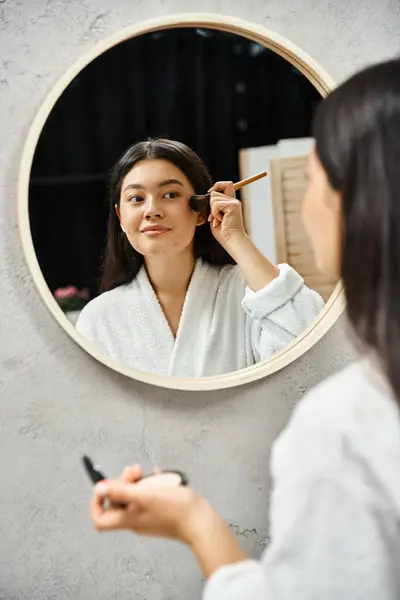 Young asian woman with brunette hair and acne applying powder with brush, skin issues and makeup — Stock Photo