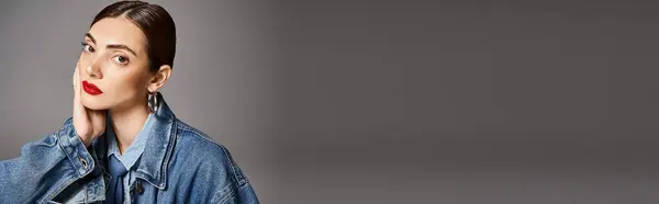 A young Caucasian woman with brunette hair wearing a jean jacket and bold red lipstick, banner — Stock Photo