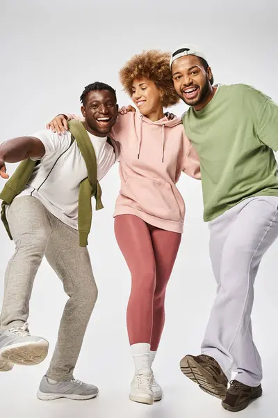 Excited african american friends standing on grey background, Juneteenth celebration — Stock Photo
