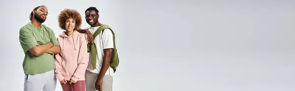 Happy african american people looking at camera on grey backdrop, Juneteenth celebration banner — Stock Photo