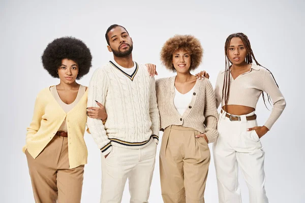 Group of elegant african american friends standing together on grey background, Juneteenth concept — Stock Photo