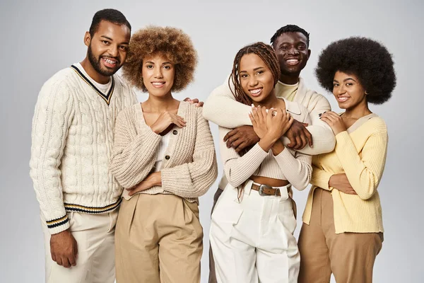 Group of cheerful african american people in casual attire standing on grey background, Juneteenth — Stock Photo