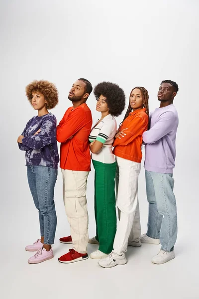 African american people in casual attire posing together on grey backdrop, Juneteenth concept — Stock Photo