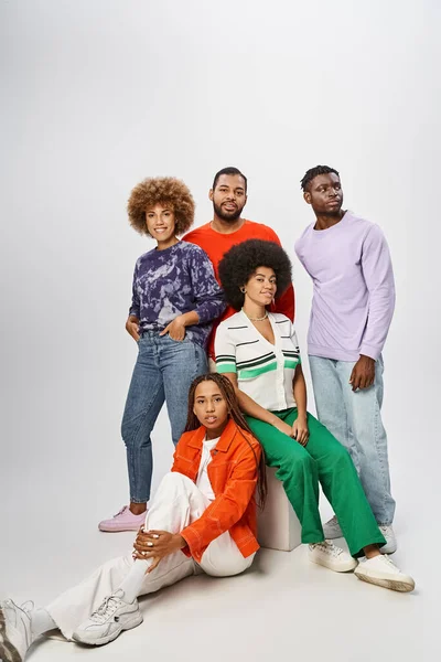 Happy african american community in casual attire posing together on grey backdrop, Juneteenth — Stock Photo
