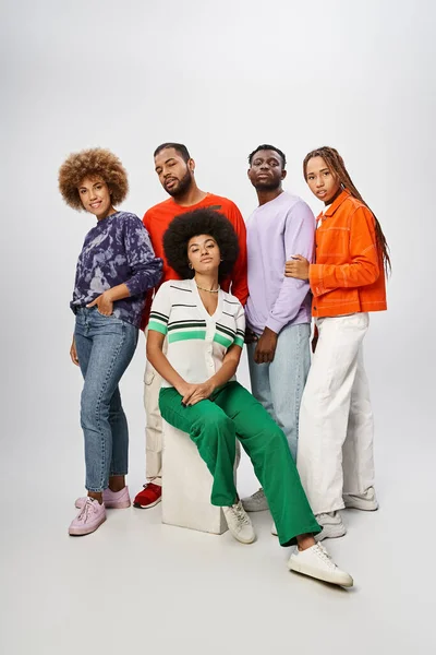 Cheerful african american community in casual attire posing together on grey backdrop, Juneteenth — Stock Photo