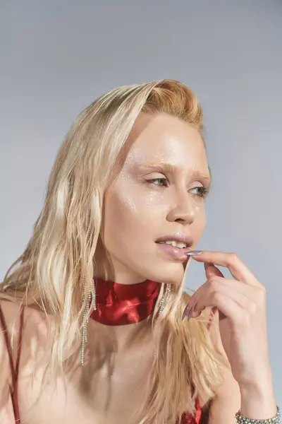 Good looking young female model with highlighter on face and green eyes posing and looking away — Stock Photo