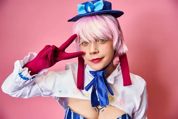 Joyous young woman cosplaying anime character and showing peace gesture and looking at camera — Stock Photo