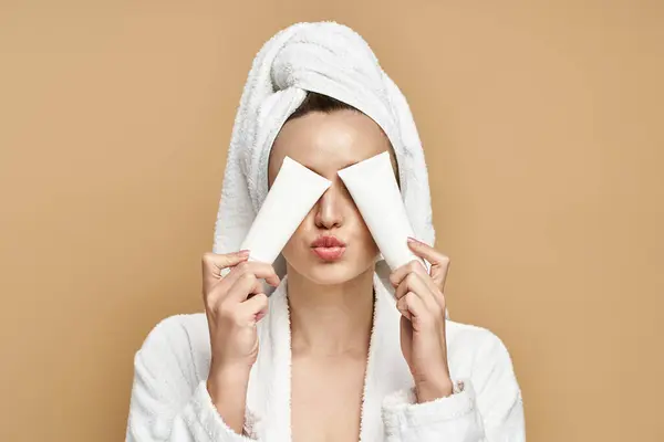 Woman with a towel covering her eyes, embodying tranquility and beauty with a touch of mystery. — Stock Photo