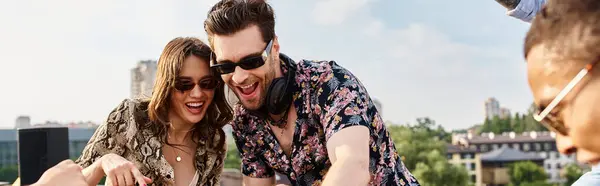 Cheerful multicultural  friends with trendy sunglasses having great time at rooftop party with DJ — Stock Photo