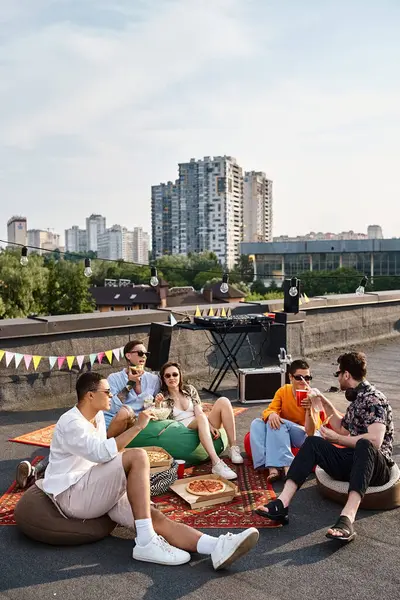 Cheerful diverse young friends in casual outfits with sunglasses enjoying pizza and drinks at party — Stock Photo