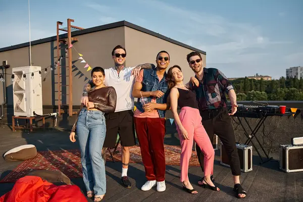 Joyous attractive multiracial people in fashionable attires smiling at camera at rooftop party — Stock Photo