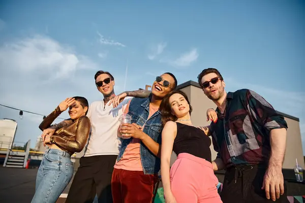 Joyful attractive multicultural people in stylish attires smiling happily at camera at rooftop party — Stock Photo
