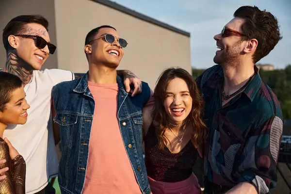Good looking diverse joyous friends with sunglasses having great time together at rooftop party — Stock Photo