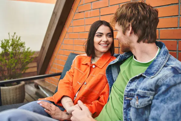 A man and a woman peacefully sitting next to each other, sharing a moment of quiet companionship and connection — Stock Photo