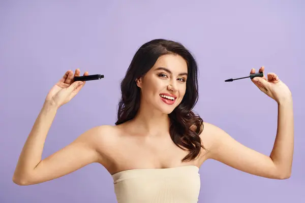 A woman with natural beauty holding mascara in her hands. — Stock Photo