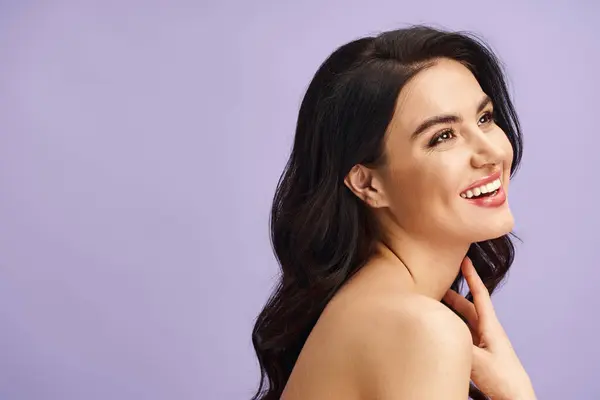 Smiling woman with long black hair smiling happily. — Stock Photo