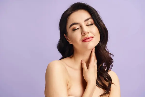 A woman with hands on chest in a serene pose. — Stock Photo