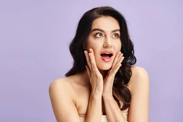 Woman with hands on face, with makeup in a graceful pose. — Stock Photo