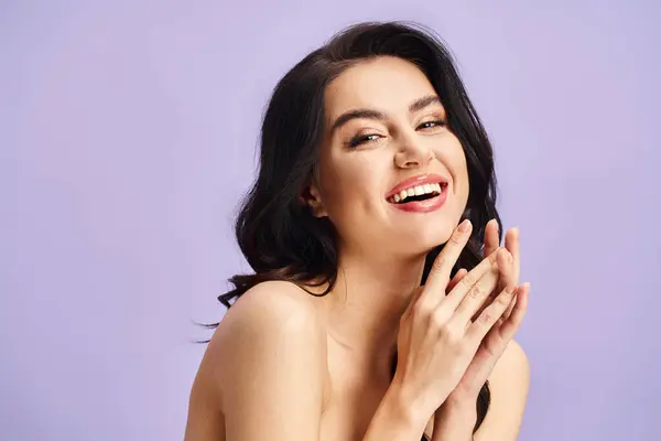 A beautiful woman smiling with hands clasped. — Stock Photo