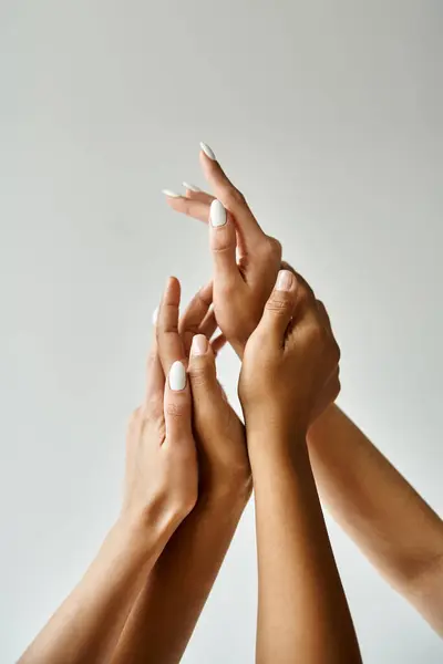 Diverse group of women, hands intertwined in unity. — Stock Photo