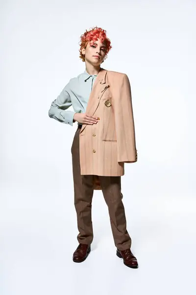 Extraordinary woman in a suit and tie standing confidently with hands on hips. — Stock Photo