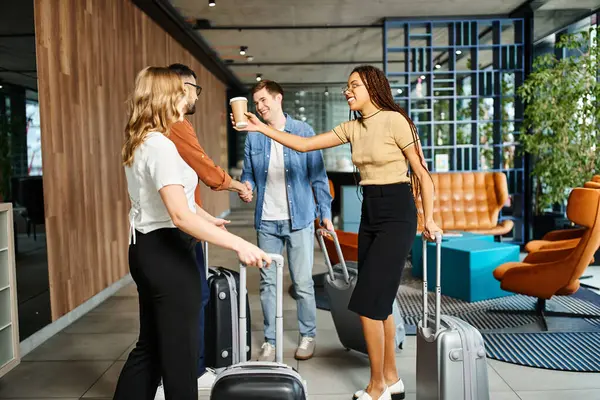 Multicultural colleagues in casual attire gather with luggage in a hotel lobby during a corporate trip. — Stock Photo