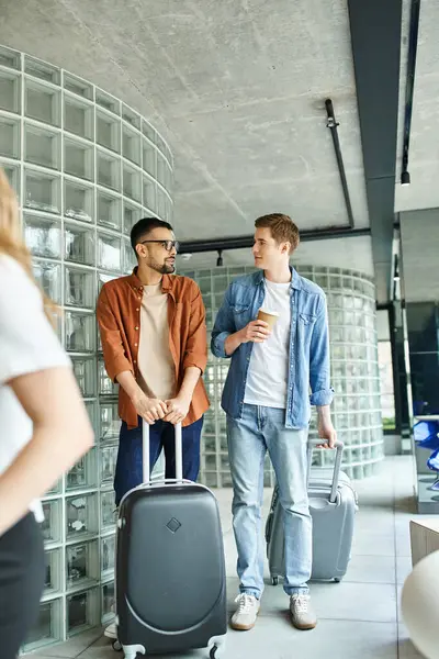 Colleagues, walking together with luggage during a corporate trip, displaying a businesspeople lifestyle. — Stock Photo