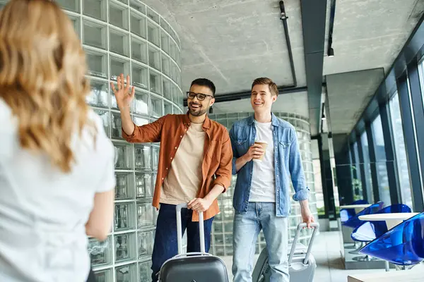 Colleagues gather with luggage in a hotel, preparing for a corporate trip full of anticipation and excitement. — Stock Photo